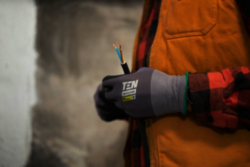 electrical cables held by an electrician